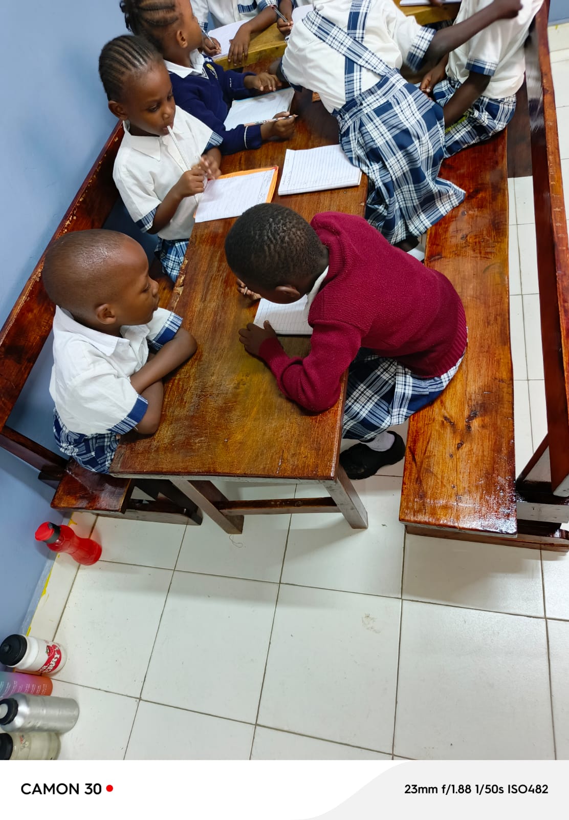 Students studying together in a group with their notebooks